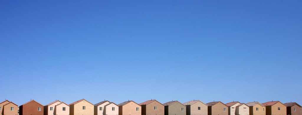 The back edge of a community of tract homes in the Las Vegas desert.